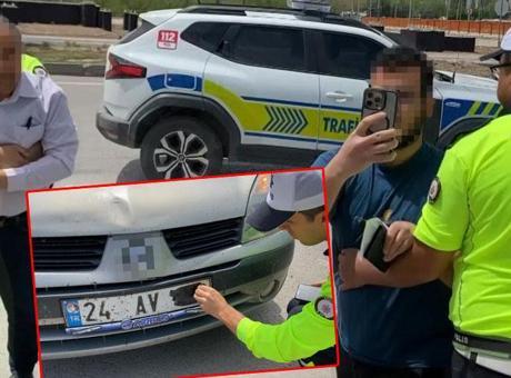 Plakasını bantla kapatan baba ve oğlu polis ablukaya aldı! Şoke eden savunma