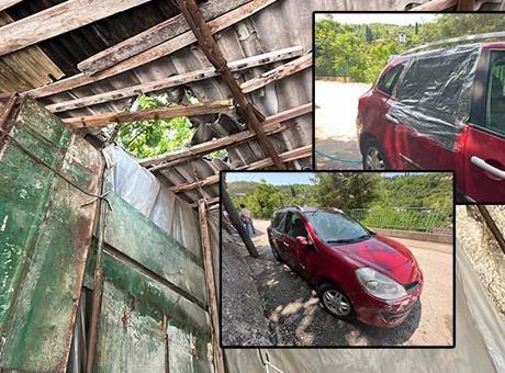 Garaj çatısına çıkan kurbanlık boğa, otomobilin üzerine düştü
